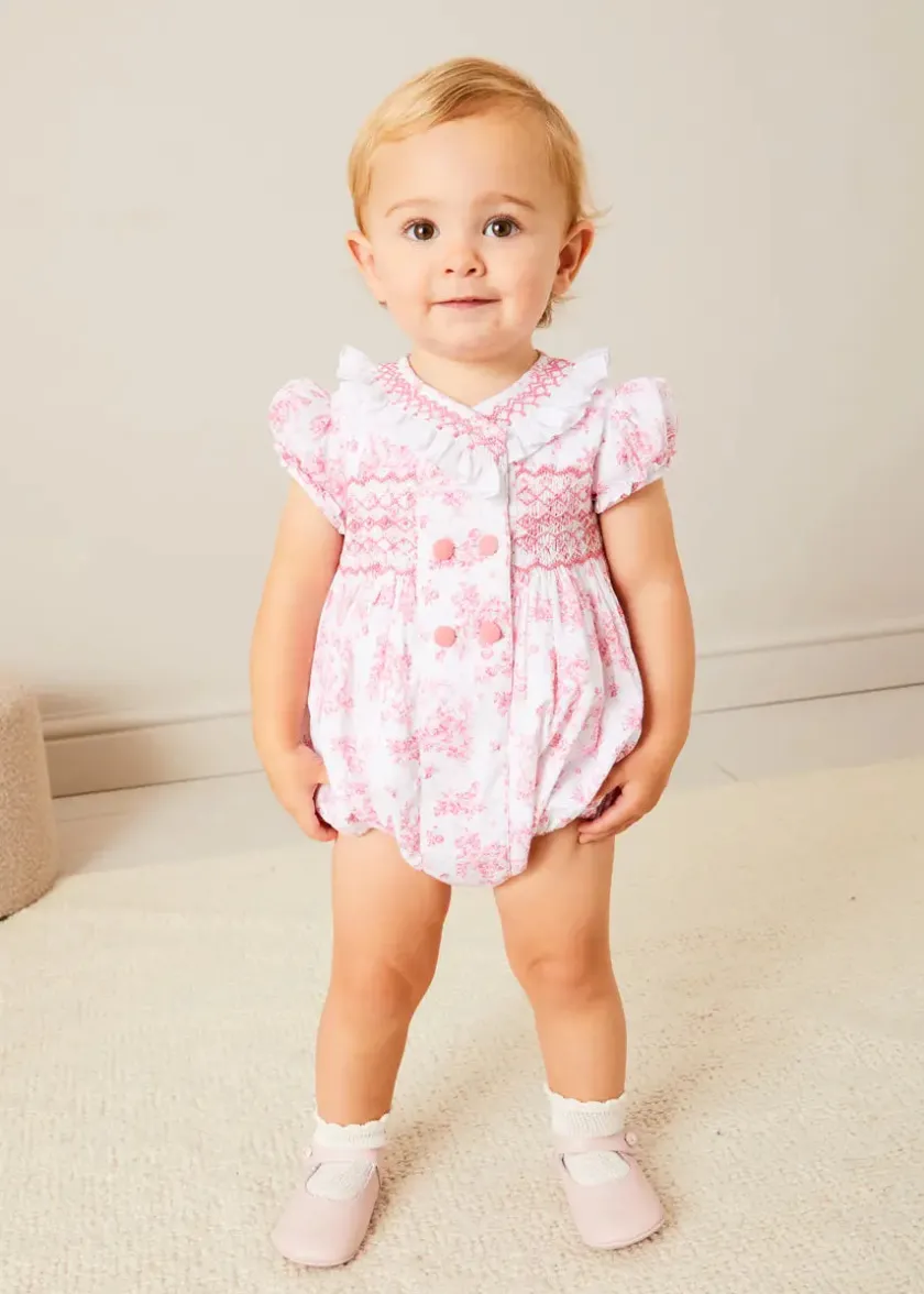 Lookbooks | Pepa London Audrey Hand Smocked Double Breasted Short Sleeve Romper in Pink (6mths-2yrs) | Audrey Toile Hand Smocked Bonnet in Pink (S-M) | Openwork Cotton Cardigan in Pink (6mths-10yrs) | Mary Jane Pram Shoes in Pink (17-20EU) | Openwork short socks White (0mths-8yrs)