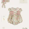 Lookbooks | Pepa London Clementine Floral Hand Smocked Double Breasted Short Sleeve Romper in Coral (6mths-3yrs) | Clementine Floral Hand Smocked Bonnet in Coral (S-M) | Openwork Cotton Cardigan in Cream (6mths-10yrs) | Leather Mary Jane Pram Shoes in Ivory (17-20EU) | Openwork short socks White (0mths-8yrs)