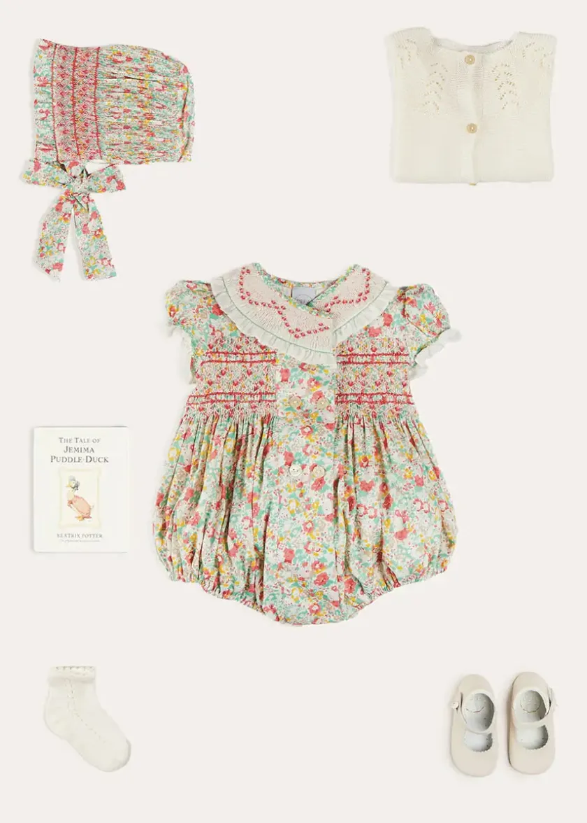Lookbooks | Pepa London Clementine Floral Hand Smocked Double Breasted Short Sleeve Romper in Coral (6mths-3yrs) | Clementine Floral Hand Smocked Bonnet in Coral (S-M) | Openwork Cotton Cardigan in Cream (6mths-10yrs) | Leather Mary Jane Pram Shoes in Ivory (17-20EU) | Openwork short socks White (0mths-8yrs)