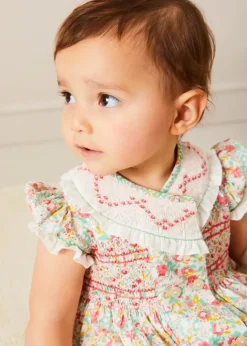 Rompers | Rompers | Pepa London Clementine Floral Hand Smocked Double Breasted Short Sleeve Romper in Coral (6mths-3yrs)