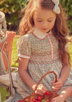 Lookbooks | Pepa London Cordelia Floral Hand-Smocked Short Sleeve Dress in Pink Made with Liberty Fabric (12m-6yrs) | Openwork Cotton Cardigan in Pink (6mths-10yrs) | Leather Mary Jane Shoes in Pink (24-34EU) | Cordelia Floral Medium Bow Clip in Pink Made with Liberty Fabric | Celebration Short Socks with ruffle - Sand (0mths-10yrs)