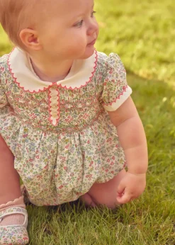 Lookbooks | Pepa London Cordelia Floral Hand-Smocked Short Sleeve Romper in Pink Made with Liberty Fabric (3m-2yrs) | Openwork Cotton Knitted Bonnet in Pink (S-L) | Openwork Cotton Cardigan in Pink (6mths-10yrs) | Cordelia Liberty Floral Mary Jane Pram Shoes in Pink (17-20EU) | Flower Fairies of the Spring Book in White | Cordelia Floral Small Bow Clip in Pink Made with Liberty Fabric | Openwork short socks White (0mths-8yrs)