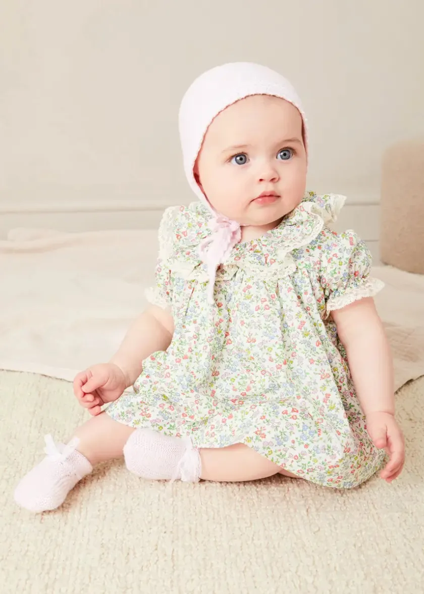 Lookbooks | Pepa London Cordelia Floral Ruffle Collar Short Sleeve Dress in Green Made with Liberty Fabric (1-12m) | Openwork Detail Baby Cardigan in Pink (1-12mths) | Lace Detail Knitted Bonnet in Pink (1-12mths) | Lace Detail Knitted Booties in Pink | Cordelia Liberty Floral Dummy Clip in Pink | Openwork short socks White (0mths-8yrs) | BIBS Dummy in Pink