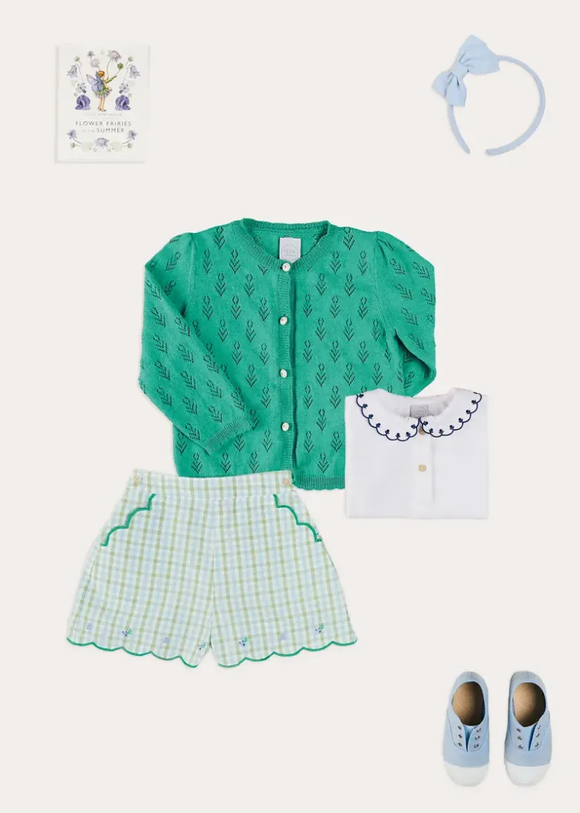 Lookbooks | Pepa London Embroidered Scallop Collar Short Sleeve Polo Shirt in Navy (2-10yrs) | Maxwell Gingham Scallop Trim Embroidered Shorts in Green (18mths-10yrs) | Floral Openwork Cotton Cardigan in Green (2-10yrs) | Canvas Plimsolls in Blue (20-35EU) | Blue Linen Big Bow Hairband | Flower Fairies of the Summer Book in White