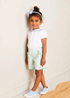 Lookbooks | Pepa London Embroidered Scallop Collar Short Sleeve Polo Shirt in Navy (2-10yrs) | Maxwell Gingham Scallop Trim Embroidered Shorts in Green (18mths-10yrs) | Floral Openwork Cotton Cardigan in Green (2-10yrs) | Canvas Plimsolls in Blue (20-35EU) | Blue Linen Big Bow Hairband | Flower Fairies of the Summer Book in White