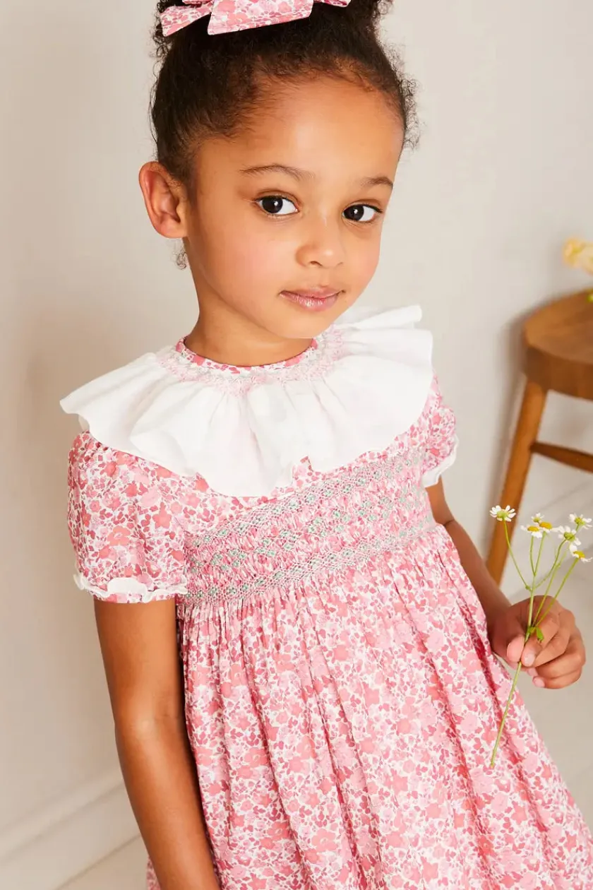 Lookbooks | Pepa London Emilia Floral Hand Smocked Ruffle Collar Short Sleeve Dress in Pink (12mths-10yrs) | Openwork Cotton Cardigan in Cream (6mths-10yrs) | Girls Ivory Leather Mary Jane Shoes (20-34EU) | Emilia Floral Long Bow Hair Clip in Pink | Openwork short socks White (0mths-8yrs)