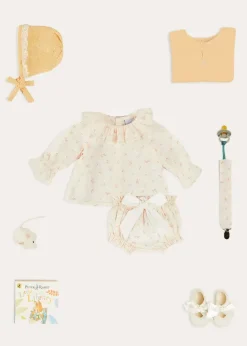 Lookbooks | Pepa London Esme Floral Ruffle Collar Long Sleeve Blouse in White (1-12mths) | Esme Floral Bow Detail Bloomers in White (1-12mths) | Openwork Detail Cotton Baby Cardigan in Tangerine (1-12mths) | Lace Detail Knitted Bonnet in Tangerine (1-12mths) | Celebration Ribbon Detail Mary Jane Pram Shoes in Beige (17-20EU) | Esme Floral Dummy Clip in White | Little Library Book in White