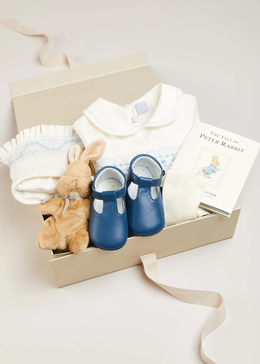 First Outfits | Gifting | Pepa London Gift boxes | Off White and Blue Hand Smocked Baby Bonnet | Plain high socks - Cream (0mths-10yrs) | Leather T-Bar Pram Shoes in Classic Blue (17-20EU) | My First Bunny in a Box - Blue