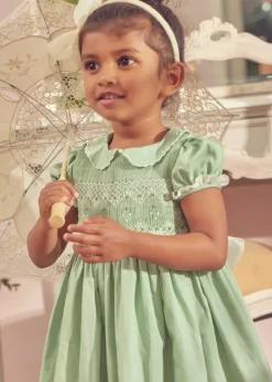 Lookbooks | Pepa London Hand Smocked Peter Pan Collar Short Sleeve Dress in Green (12mths-10yrs) | Openwork Cotton Cardigan in Cream (6mths-10yrs) | Girls Ivory Leather Mary Jane Shoes (20-34EU) | Traditional Big Bow Tulle Hairband in Ivory | Flower Fairies of the Spring Book in White | Openwork short socks White (0mths-8yrs)