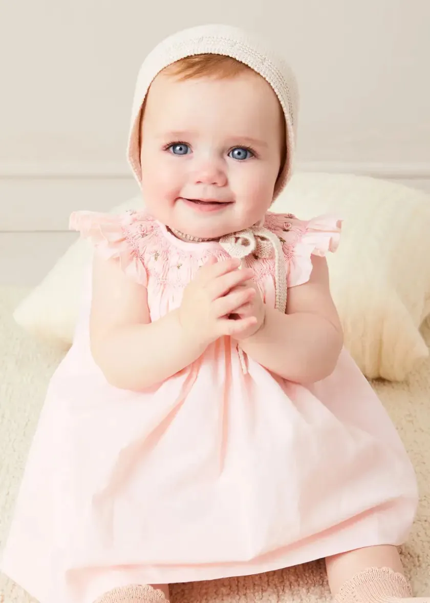 Lookbooks | Pepa London Hand Smocked Sleeveless Dress With Bloomers in Pink (1-12mths) | Openwork Detail Baby Cardigan in Pink (1-12mths) | Openwork Knitted Bonnet in Beige(S-L) | Cordelia Liberty Floral Mary Jane Pram Shoes in Pink (17-20EU) | Cordelia Liberty Floral Dummy Clip in Pink | Knitted Bunny Teether in Beige | BIBS Dummy in Pink