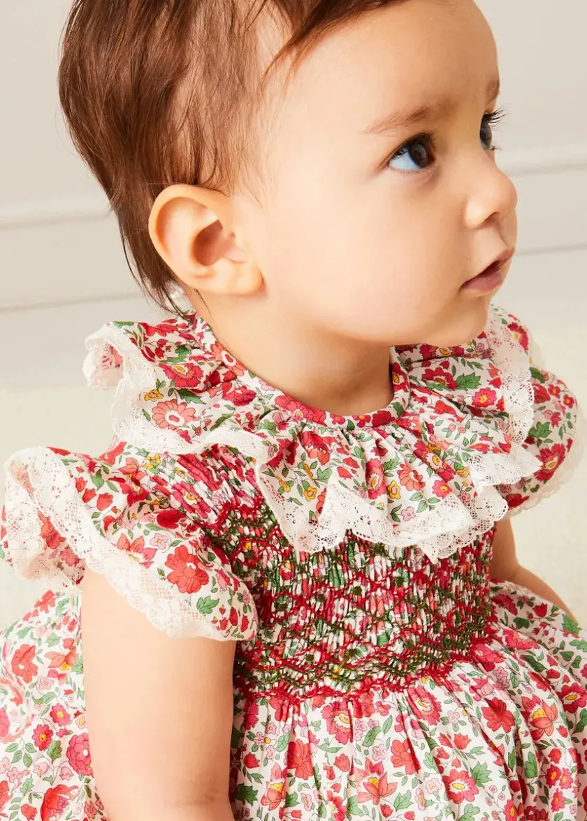 Lookbooks | Pepa London Margot Floral Romper in Red Made with Liberty Fabric (6m-2yrs) | Openwork Cotton Cardigan in Cream (6mths-10yrs) | Openwork Cotton Knitted Bonnet in Cream (S-L) | Leather Mary Jane Pram Shoes in Red (17-20EU) | Margot Dummy Clip in Red Made with Liberty Fabric | Openwork short socks White (0mths-8yrs) | BIBS Dummy in Pink