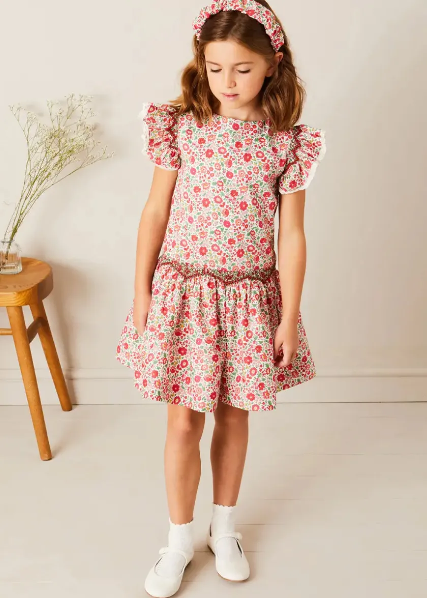 Lookbooks | Pepa London Margot Floral Sleeveless Hand-Smocked Dress in Red Made with Liberty Fabric (4-12yrs) | Openwork Cotton Cardigan in Cream (6mths-10yrs) | Girls Ivory Leather Mary Jane Shoes (20-34EU) | Margot Liberty Floral Scrunchie Hairband in Red | Openwork short socks White (0mths-8yrs)