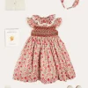 Lookbooks | Pepa London Margot Hand-Smocked Dress in Red Made with Liberty Fabric (12m-6yrs) | Openwork Cotton Cardigan in Cream (6mths-10yrs) | Mary Jane Leather Baby Shoes in Ivory (20-24EU) | Margot Liberty Floral Scrunchie Hairband in Red | Openwork short socks White (0mths-8yrs)