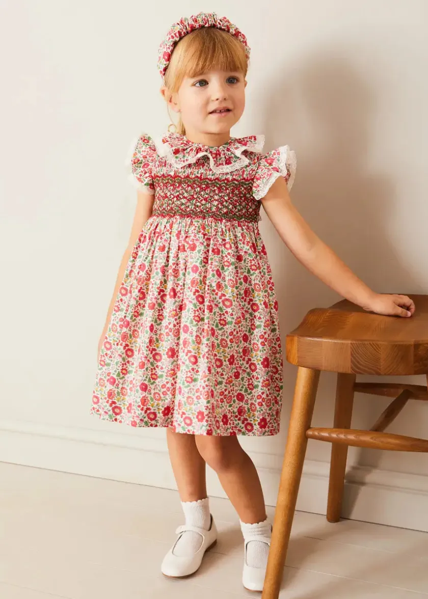 Lookbooks | Pepa London Margot Hand-Smocked Dress in Red Made with Liberty Fabric (12m-6yrs) | Openwork Cotton Cardigan in Cream (6mths-10yrs) | Mary Jane Leather Baby Shoes in Ivory (20-24EU) | Margot Liberty Floral Scrunchie Hairband in Red | Openwork short socks White (0mths-8yrs)