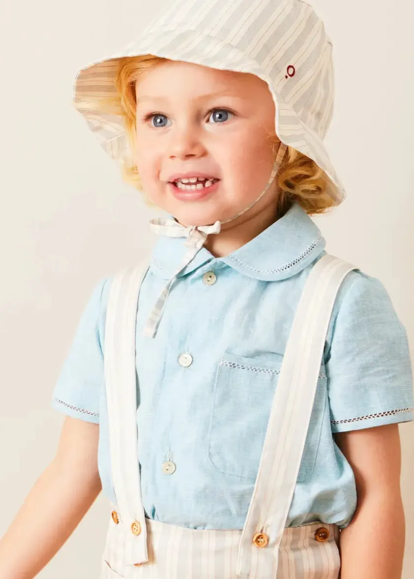 Lookbooks | Pepa London Peter Pan Collar Trim Detail Short Sleeve Shirt in Blue (12mths-5yrs) | Brompton Striped Shorts With Braces in Beige (12mths-4yrs) | Plain Cardigan in Navy (6mths-10yrs) | Woven T-Bar Baby Shoes in Navy (20-26EU) | Brompton Striped Sun Hat in Beige (XS-M) | Ribbed Short Socks - Cream (0mths-10yrs)