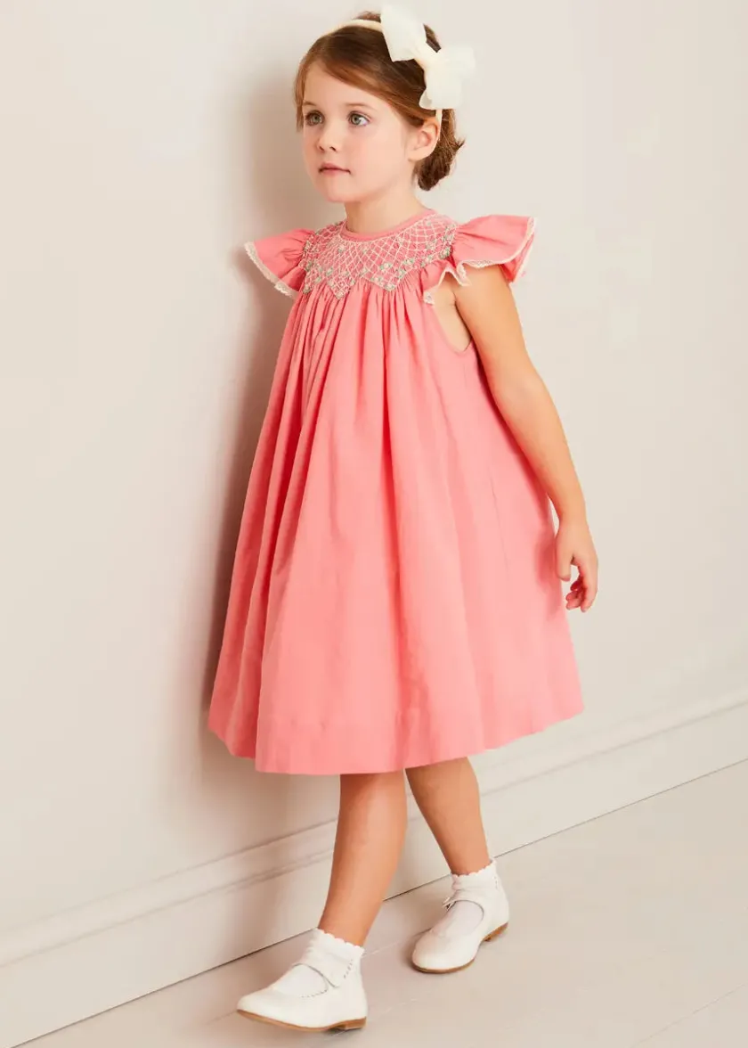 Lookbooks | Pepa London Plain Hand Smocked Sleeveless Dress in Coral (12mths-10yrs) | Plain Cardigan in Cream (6mths-10yrs) | Girls Ivory Leather Mary Jane Shoes (20-34EU) | Traditional Big Bow Tulle Hairband in Ivory | Openwork short socks White (0mths-8yrs)