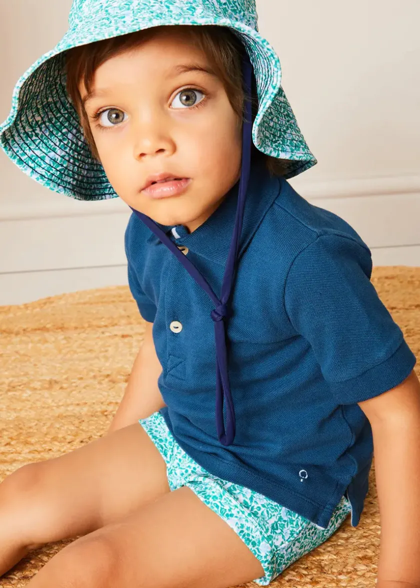 Lookbooks | Pepa London Plain Short Sleeve Polo Shirt in Navy (2-10yrs) | Adelaide Floral Swim Shorts in Green (12mths-4yrs) | Adelaide Floral Beach Hat in Green (S-M)