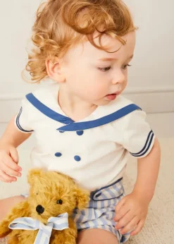Lookbooks | Pepa London Regency Stripe Mariner Collar Two Piece Set With Bloomers in Blue (6mths-3yrs) | Plain Cardigan in Navy (6mths-10yrs) | Openwork Knitted Bonnet in Navy (S-L) | T-Bar Baby Shoes in Blue (20-26EU) | Cotton Short Socks Cream (0mths-10yrs) | Limited Edition Merrythought & Pepa Teddy Bear With Regency Striped Bow in Blue (S-L)